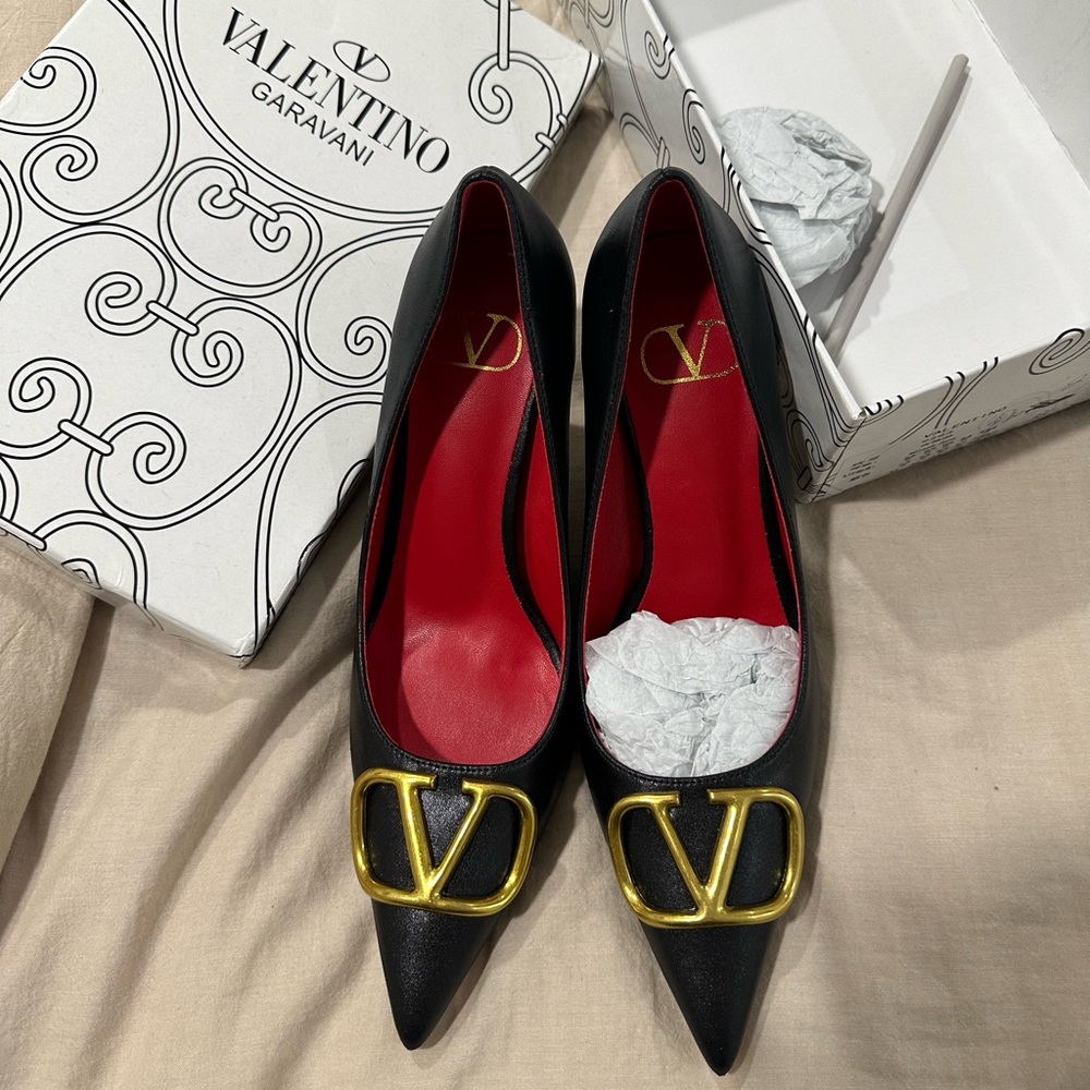 Black and gold pumps